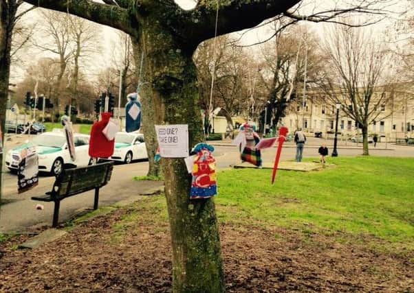 Hot water bottles are being hung on trees for the homeless QuTL7LvE0jQXnliQuiwn