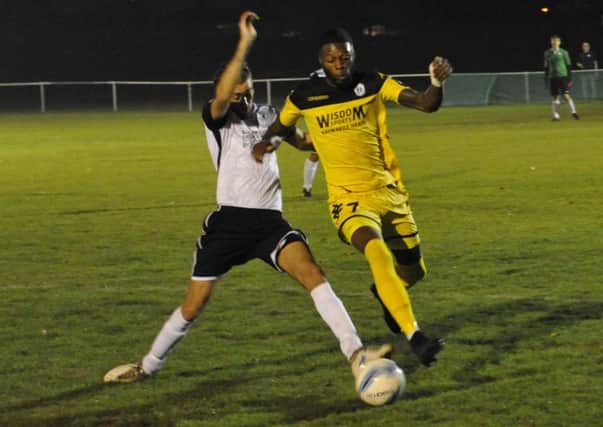 Bexhill United full-back Nathan Lopez challenges Patrick Akwasi-Bronyan. Pictures by Simon Newstead