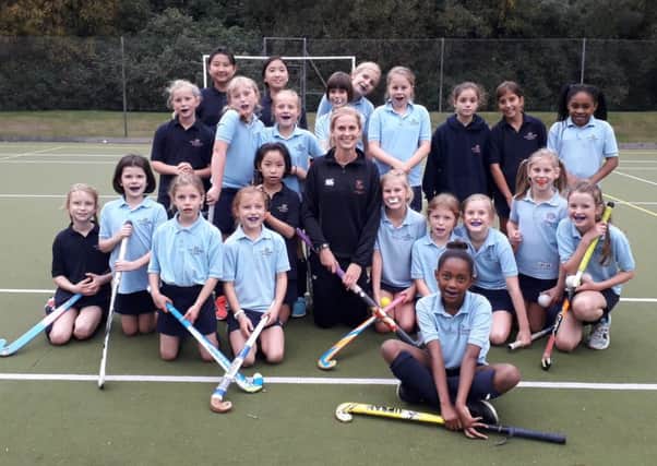 Leah Wilkinson with the school's girls hockey team
