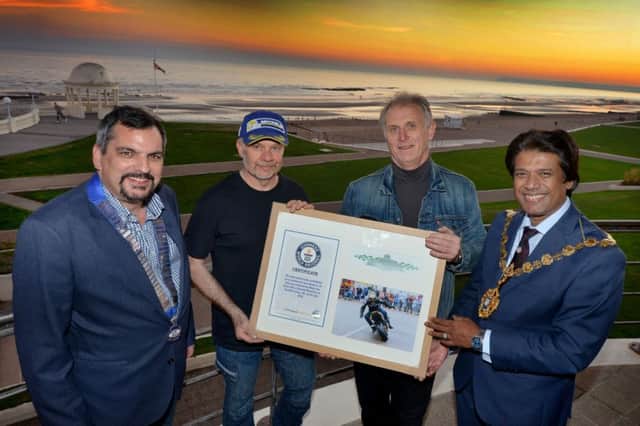 Motorcycle stunt Guinness World Record presentation at the De La Warr Pavilion with motorcycle stunt legend Mark Van Driel.  L-R Councillor Simon Elford, Mark Van Driel, Howard Martin (Director of HEM Events LTD) and Mayor of Bexhill Abul Azad. SUS-181010-072002001