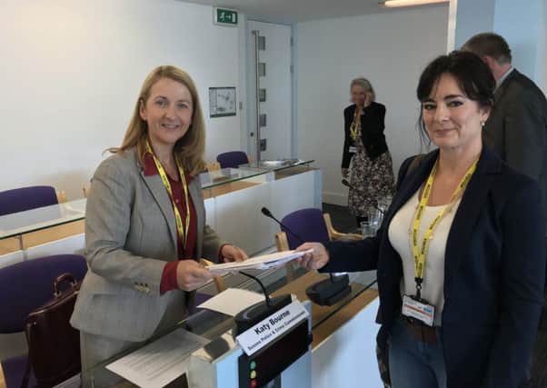 Horsham Labour Partys Karen Symes hands over a petition to Police and Crime Commissioner Katy Bourne