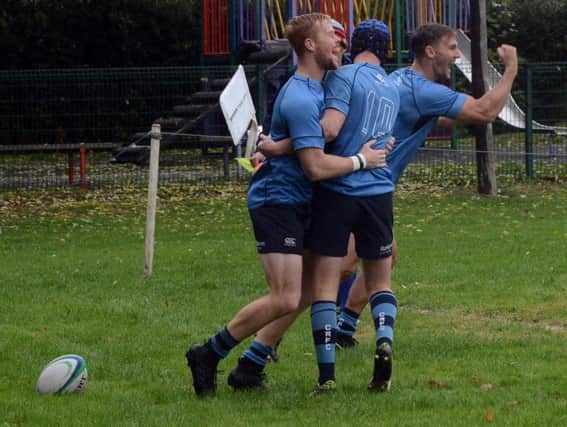 Rhys Thompson's try is celebrated by the Blues / Picture by Kate Shemilt