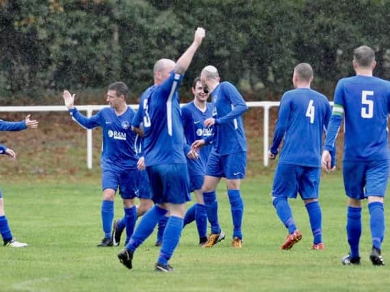 Storrington celebrate a goal in the win over Mile Oak. Picture by Stephen Goodger