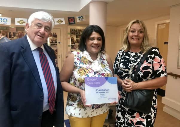 Alun Thomas, Shaw Healthcare chairman, home manager Monica Donald and Jess Loader, chairman of Adur District Council celebrating Elmcroft Care Home's 10th anniversary