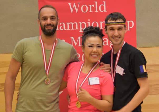 Thai master Jidapha Wilkinson, centre, with other medallists at the world massage championship