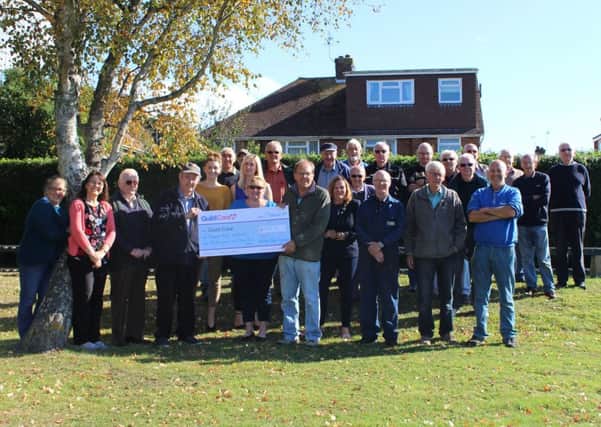Worthing and District Society of Model Engineers present the cheque to Guild Care community fundraiser Auds Stapleton at Field Place Miniature Railway
