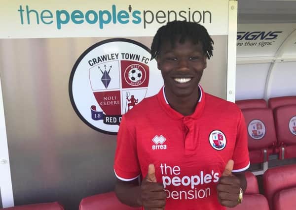 Crawley Town have signed David Sesay on a two-year deal