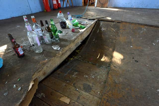 'We are devastated' ... the badly damaged floor of the building