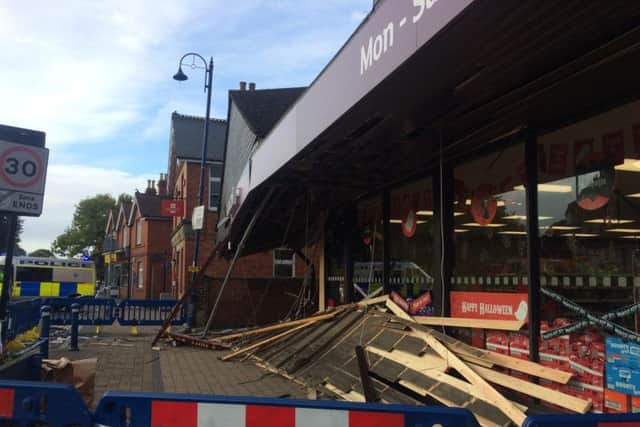 Debris under the front entrance of Sainsbury's in Billingshurst after the ram raid. Photo: Anna Khoo