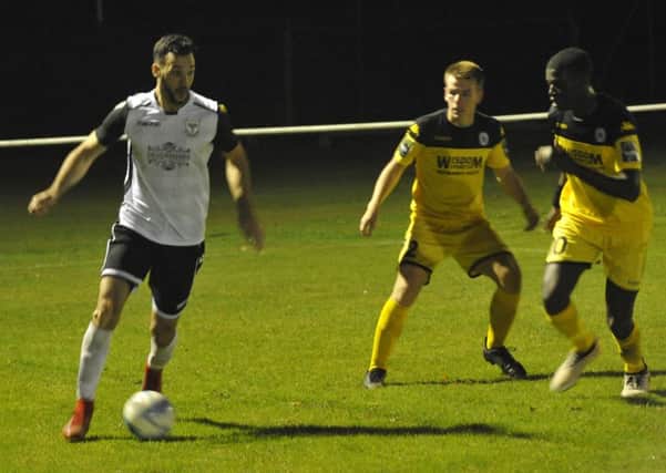 Jack McLean on the ball for Bexhill United against Haywards Heath Town on Tuesday night. Picture by Simon Newstead