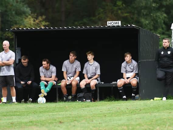 Football: SCFL Premier Division. Loxwood v Hassocks. Pictured is Loxwood manager Gareth Neathey (right) in dugout. Picture: Liz Pearce