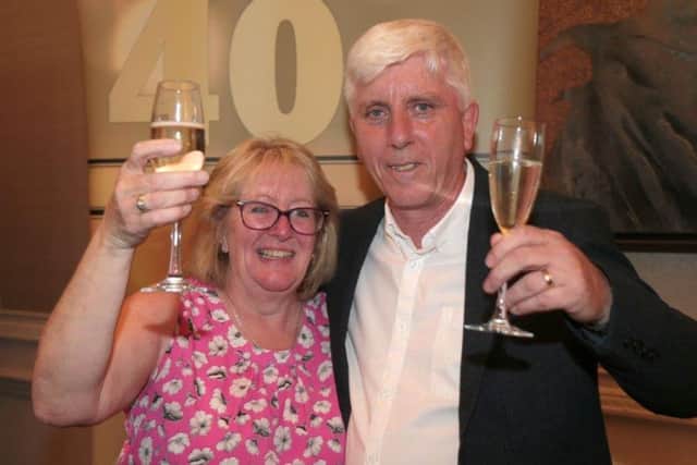 Debra Churcher and Michael Dunbar celebrating their awards for 40 years' service at UK Power Networks