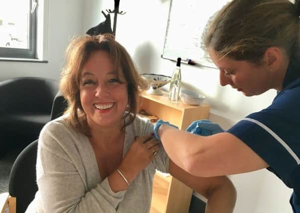 Marianne Griffiths, chief executive at BSUH, leads the annual staff flu vaccination campaign at the Royal Sussex County Hospital