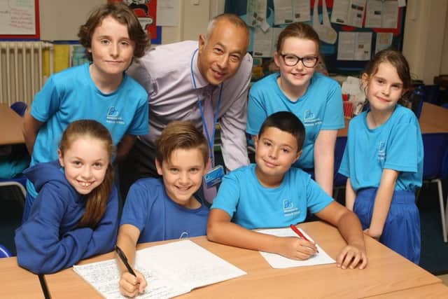 Headteacher Jez Wong, and pupils (from left), Gracie Hodgson-Prior 10, Rory Fallon 11, Lizzie O'Haire, 11, and Ena Downes, 10. Photo by Derek Martin Photography.