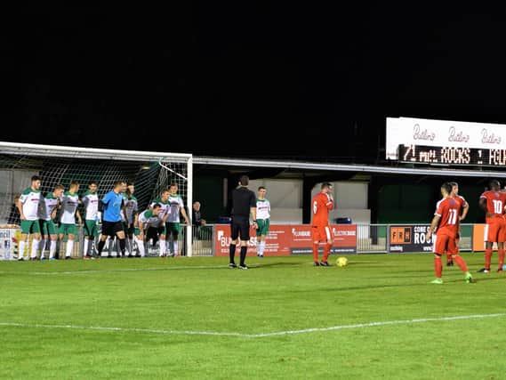 The Rocks prepare to defend a free-kick just outside the six-yard box - but Folkestone scored when it was allowed to be retaken after Dan Lincoln cleared the first one / Picture by Darren Crisp