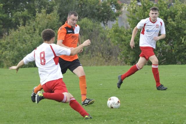 The JC Tackleway and Mountfield United battle it out at Barley Lane