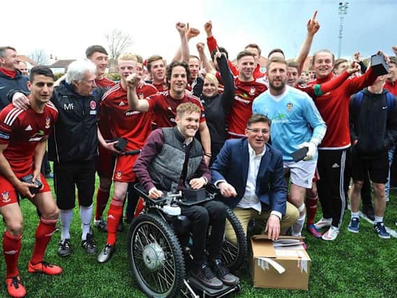 Calvin Buckland (front row, right) celebrates Worthing's promotion in 2016
