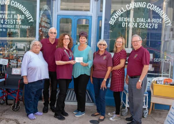 Lion President Clare Kersley presents  cheque to Jackie Haggertey, Manager of BCC. with Lions and BCC staff SUS-181023-105029001