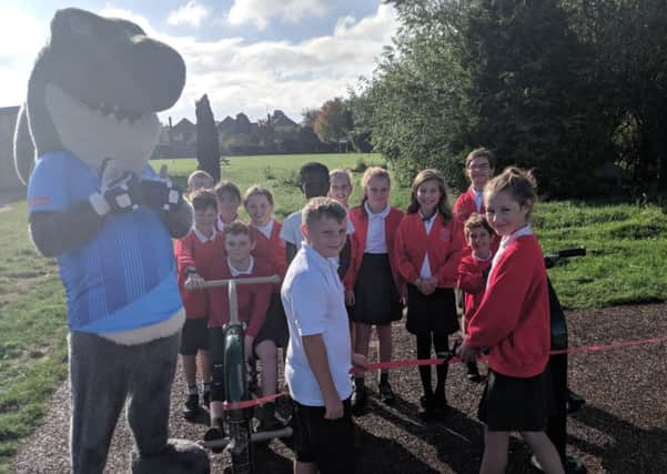 School sports ambassadors officially opened the new play equipment with the help of Sid the Shark