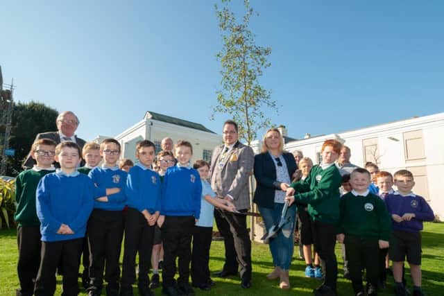 The mayor of Littlehampton, Billy Blanchard-Cooper and the deputy mayor, Tracey Baker, with the help of school children plant two trees next to the Manor House in dedication to the Duke and Duchess of Sussex
