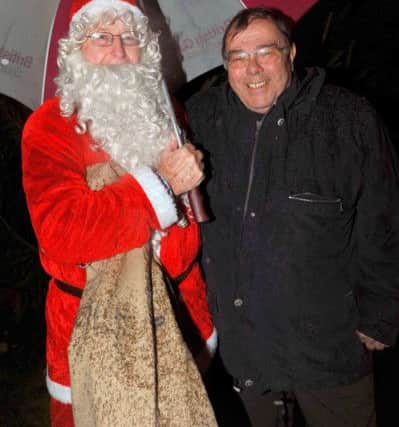 Santa and Cllr Stuart Earl at the switch-on of the Little Common Christmas lights in December 2012