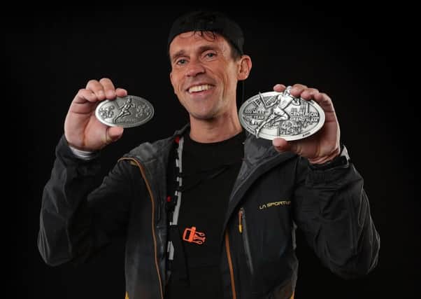Paul McCleery proudly displays his latest medals. Picture courtesy Stuart March Photography