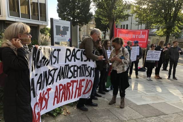 Anti-racism campaigners and supporters of Palestine outside Hove Town Hall