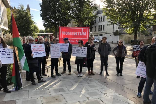 Anti-racism campaigners and supporters of Palestine outside Hove Town Hall