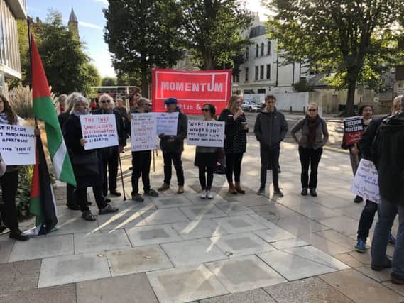 Anti-racism campaigners and supporters of Palestine outside Hove Town Hall
