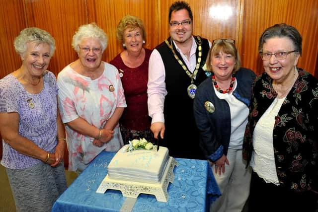 Littlehampton mayor Billy Blanchard-Cooper cutting the 60th anniversary cake back in May. Picture: Steve Robards SR1812917