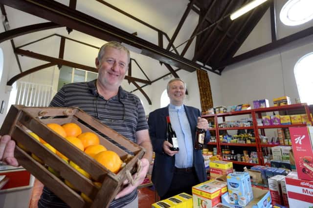 Rob Wallace and the Rev James Hollingsworth in the temporary shop at St Francis Church