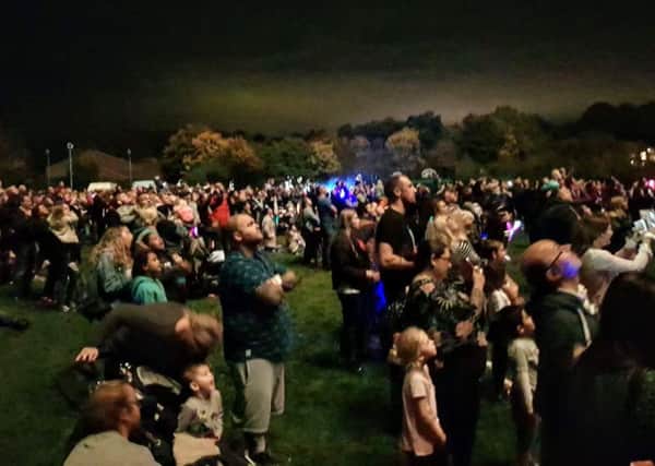 Crowds gathers to watch the firework display