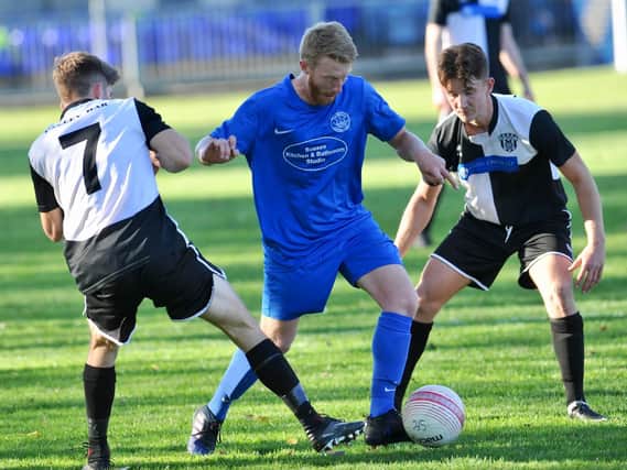 Action from East Preston's clash at Shoreham. Picture by Stephen Goodger