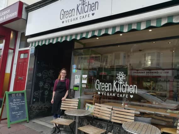 Catherine outside Green Kitchen, an independent cafe on Preston Road