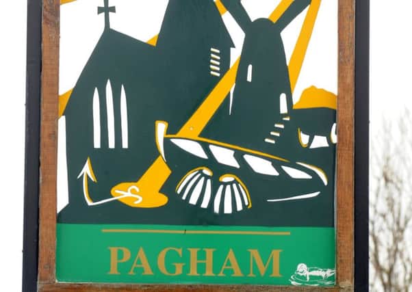 Pagham's village sign Picture by Louise Adams C131616-4 Bog Pagham Village ENGSUS00120130112153646