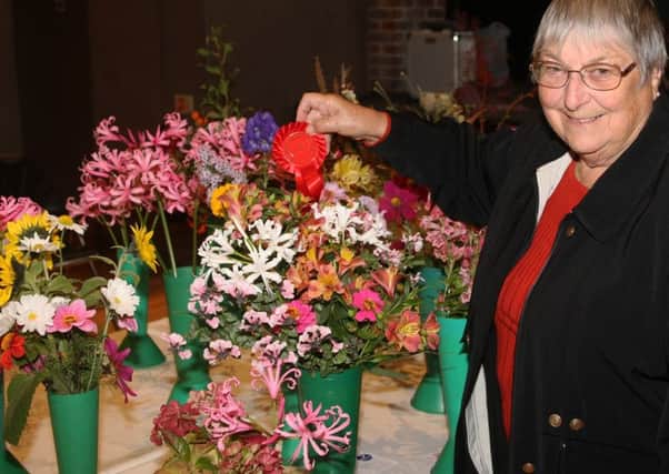 Val ONeill won the Red Ribbon for best exhibit of flowers from the garden. Picture: Derek Martin DM18103753a