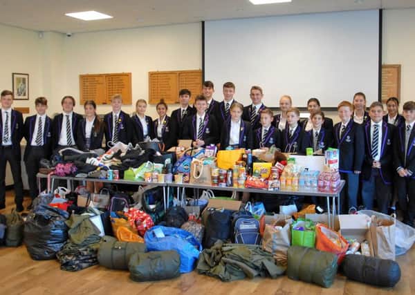 Shoreham College pupils brought in hundreds of items of clothing, food and other essential supplies to donate to Hove-based Charity Off The Fence