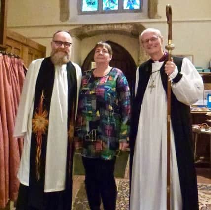 The Rev Richard Hayes, rector of St Marys Church in Yapton, with Angela Stewart, who came up with the idea of a Peace Window, and the Bishop of Horsham, the Rt Rev Mark Sowerby