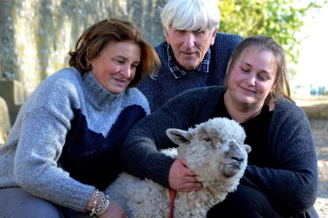 Left to right: Etta Wyatt, Keith Manning, and Heidi Blannin with Boris the sheep. Picture: Kate Shemilt