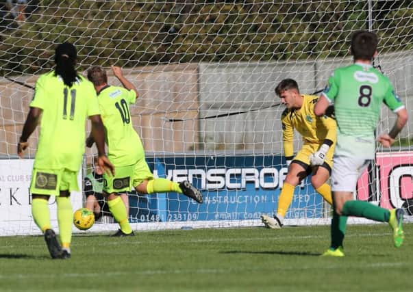 Sam Adams scores the only goal in Hastings United's victory away to Guernsey on Sunday. Picture courtesy Scott White
