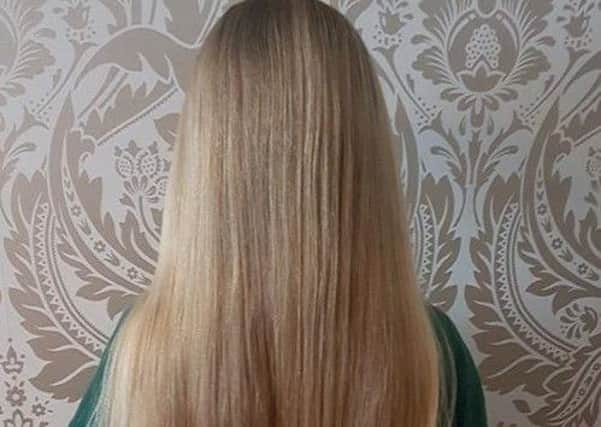 Lexi's beautuful hair prior to being cut for the Little Princess Trust SUS-181029-160328001