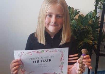 Lexi Kingshott who had her hair cut and raised around ?1400 for the Littlle Princess Trust charity SUS-181031-155629001