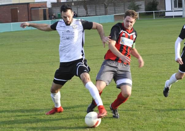 Bexhill United winger Jack McLean makes a tackle during the 1-0 win at home to Wick. Pictures by Simon Newstead
