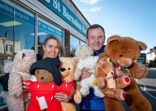 Sarah Cowley, visiting St Barnabas House Lancing shop manager, and Phil Cowley, a St Barnabas House driver, helping the Wick charity shop staff with all the teddies. Picture: Scott Ramsey