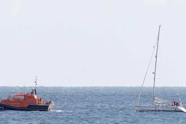 The lifeboat and yacht. Photo by Warwick Baker