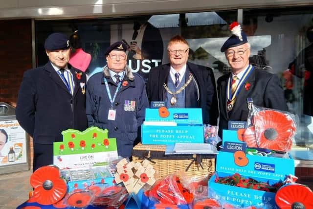 The poppy appeal in Haywards Heath launched on Saturday. Town mayor James Night is pictured at a stall in The Orchards. Photo: Burgess Hill Town Council