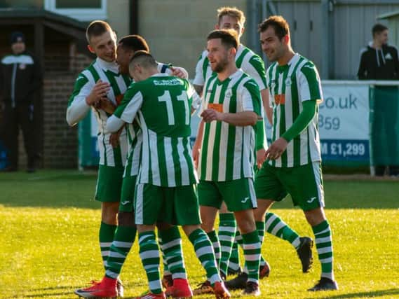 Chichester City players celebrate one of their second-half goals / Picture by Daniel Harker
