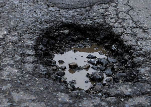Eastbourne's MP Stephen Lloyd is calling for extra funding to fix Eastbourne's potholes