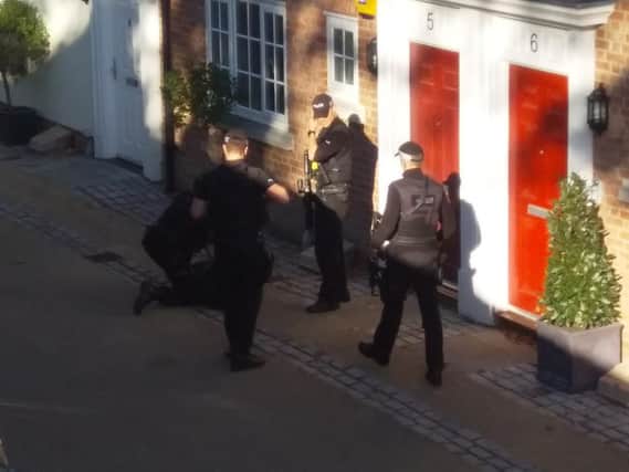 A man being arrested by armed police earlier today. Picture by Chris Hatton