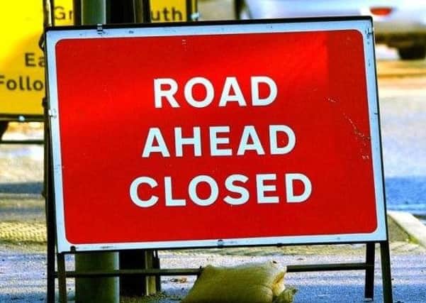 The road may remain closed into this afternoon
